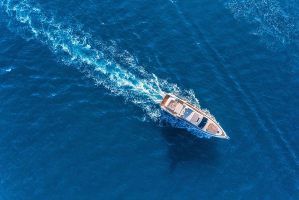 yacht-at-the-sea-aerial-view-of-luxury-floating-ship.jpg